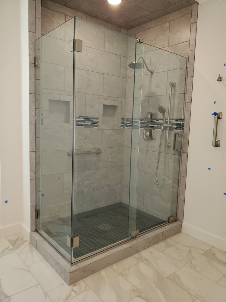 This is the Essence series slider from CR Laurence. It is a completely frameless slider without the bar across the top. The door slides across the bottom of the enclosure with only a small guide block on the top. This enclosure requires 1/2" thick glass.