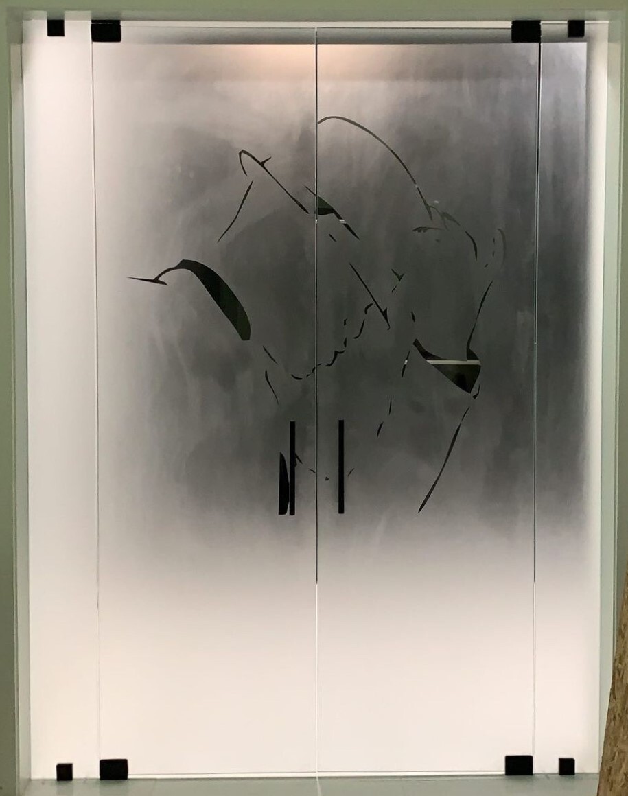 A reverse-etched closet door for Neyo with his logo on it! 