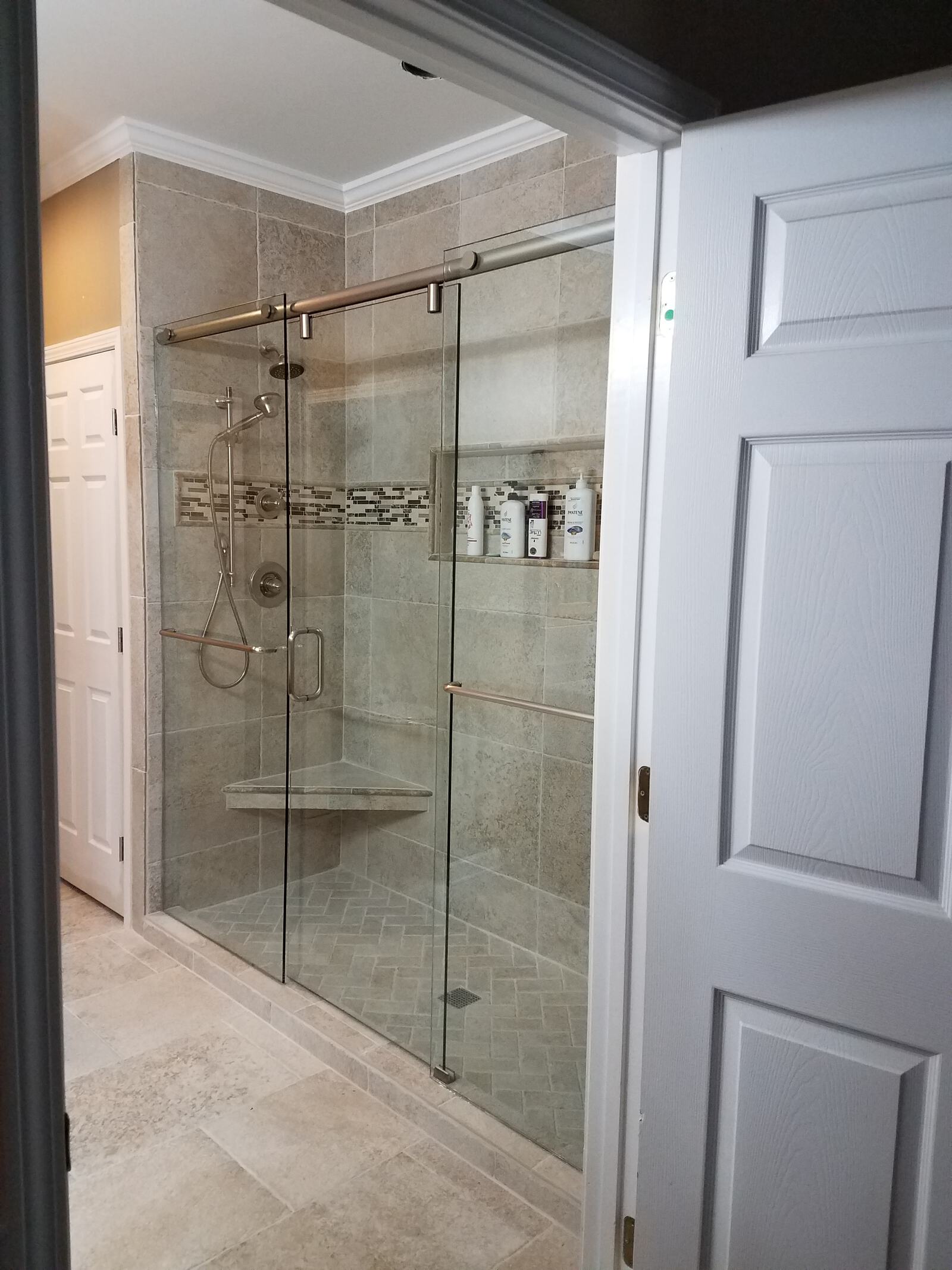 Hydroslide Shower Door.  This is similar style as the Barn Door pipeline series except rollers are inside the bar. Sophisticated design and manufactured with quality.